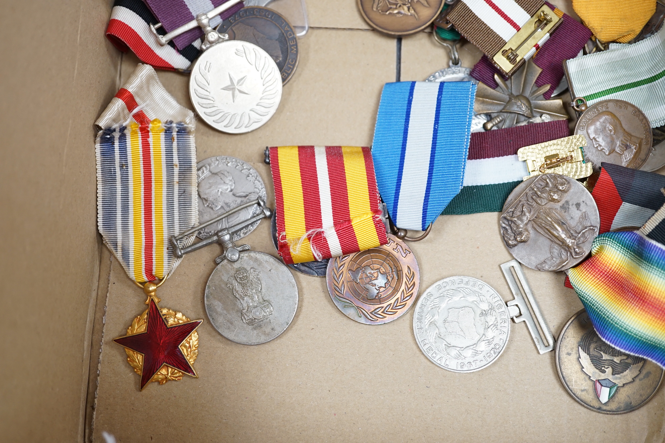 Thirty world military and commemorative medals including; a Belgium War Aid Medal 1914-18, Nigeria Republic Medal, Austri-Hungarian Medal for Bravery, Kuwaiti Liberation Medal, Pakistan Resolution Day Medal, etc.